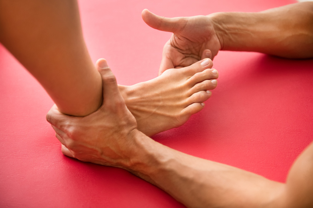 foot getting examined by a pair of hands