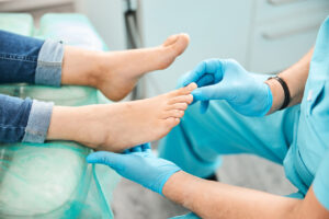 doctor checking on a persons feet
